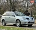 Серый Мицубиси Аутлендер, объемом двигателя 2.38 л и пробегом 170 тыс. км за 6900 $, фото 4 на Automoto.ua