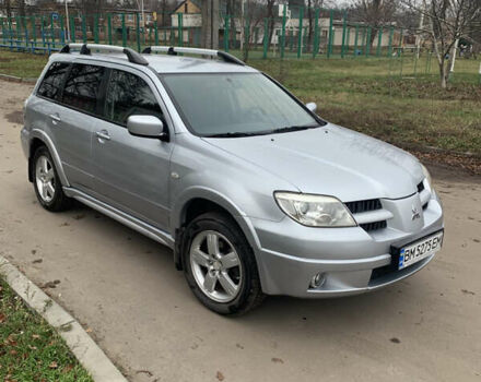 Серый Мицубиси Аутлендер, объемом двигателя 2 л и пробегом 247 тыс. км за 5999 $, фото 1 на Automoto.ua