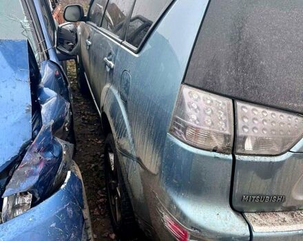 Серый Мицубиси Аутлендер, объемом двигателя 2.4 л и пробегом 205 тыс. км за 3500 $, фото 5 на Automoto.ua