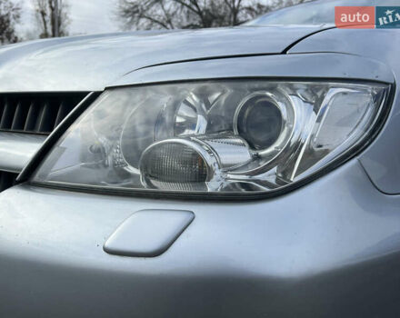 Серый Мицубиси Аутлендер, объемом двигателя 2.38 л и пробегом 197 тыс. км за 7699 $, фото 5 на Automoto.ua