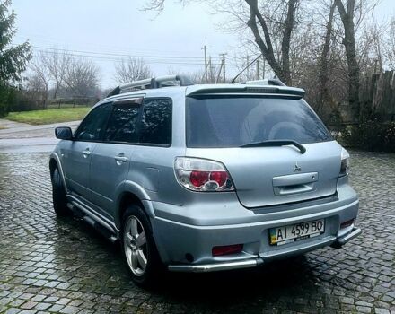 Серый Мицубиси Аутлендер, объемом двигателя 2 л и пробегом 200 тыс. км за 5800 $, фото 3 на Automoto.ua