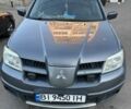 Серый Мицубиси Аутлендер, объемом двигателя 2 л и пробегом 218 тыс. км за 6100 $, фото 1 на Automoto.ua