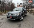 Серый Мицубиси Аутлендер, объемом двигателя 2.4 л и пробегом 237 тыс. км за 8490 $, фото 1 на Automoto.ua