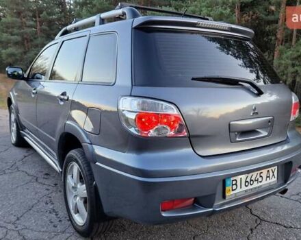 Серый Мицубиси Аутлендер, объемом двигателя 2 л и пробегом 157 тыс. км за 8300 $, фото 4 на Automoto.ua