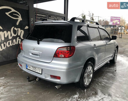 Серый Мицубиси Аутлендер, объемом двигателя 2 л и пробегом 170 тыс. км за 6950 $, фото 2 на Automoto.ua