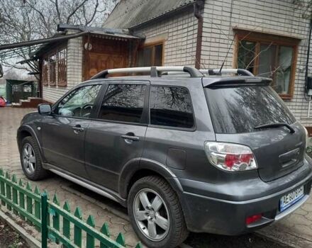 Серый Мицубиси Аутлендер, объемом двигателя 2.38 л и пробегом 143 тыс. км за 7300 $, фото 2 на Automoto.ua