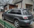 Серый Мицубиси Аутлендер, объемом двигателя 2.38 л и пробегом 143 тыс. км за 7300 $, фото 2 на Automoto.ua