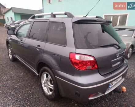 Серый Мицубиси Аутлендер, объемом двигателя 2 л и пробегом 232 тыс. км за 5950 $, фото 4 на Automoto.ua