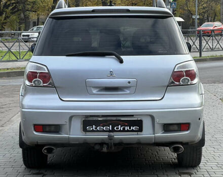 Серый Мицубиси Аутлендер, объемом двигателя 2.38 л и пробегом 197 тыс. км за 7699 $, фото 4 на Automoto.ua