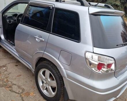 Серый Мицубиси Аутлендер, объемом двигателя 2.38 л и пробегом 113 тыс. км за 8900 $, фото 10 на Automoto.ua