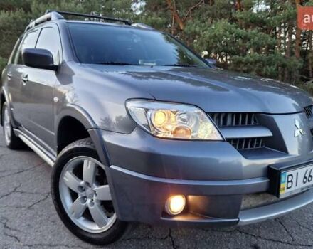 Серый Мицубиси Аутлендер, объемом двигателя 2 л и пробегом 157 тыс. км за 8300 $, фото 2 на Automoto.ua