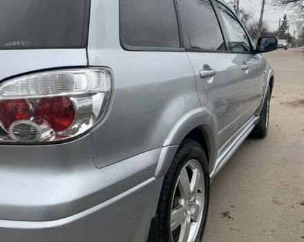 Серый Мицубиси Аутлендер, объемом двигателя 2 л и пробегом 247 тыс. км за 5999 $, фото 4 на Automoto.ua
