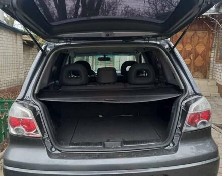 Серый Мицубиси Аутлендер, объемом двигателя 2.38 л и пробегом 143 тыс. км за 7300 $, фото 5 на Automoto.ua