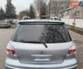 Серый Мицубиси Аутлендер, объемом двигателя 2 л и пробегом 245 тыс. км за 6700 $, фото 5 на Automoto.ua