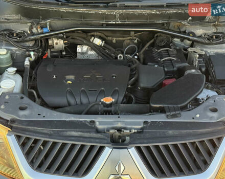 Серый Мицубиси Аутлендер, объемом двигателя 2.4 л и пробегом 210 тыс. км за 8300 $, фото 41 на Automoto.ua