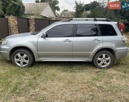 Сірий Міцубісі Аутлендер, об'ємом двигуна 2.38 л та пробігом 209 тис. км за 7460 $, фото 1 на Automoto.ua