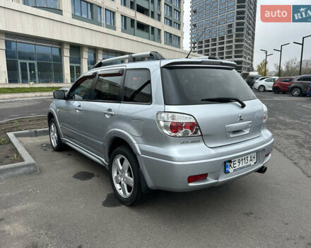 Серый Мицубиси Аутлендер, объемом двигателя 2.38 л и пробегом 81 тыс. км за 8700 $, фото 3 на Automoto.ua