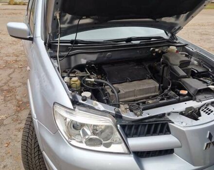 Серый Мицубиси Аутлендер, объемом двигателя 2.38 л и пробегом 113 тыс. км за 8900 $, фото 13 на Automoto.ua