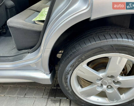 Сірий Міцубісі Аутлендер, об'ємом двигуна 2 л та пробігом 130 тис. км за 8500 $, фото 14 на Automoto.ua