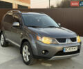 Серый Мицубиси Аутлендер, объемом двигателя 2.4 л и пробегом 210 тыс. км за 8300 $, фото 1 на Automoto.ua