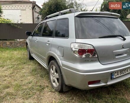 Сірий Міцубісі Аутлендер, об'ємом двигуна 2.38 л та пробігом 209 тис. км за 7460 $, фото 3 на Automoto.ua