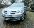 Серый Мицубиси Аутлендер, объемом двигателя 2 л и пробегом 200 тыс. км за 5800 $, фото 2 на Automoto.ua