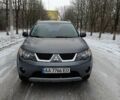 Серый Мицубиси Аутлендер, объемом двигателя 2.4 л и пробегом 244 тыс. км за 8900 $, фото 1 на Automoto.ua