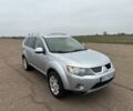 Серый Мицубиси Аутлендер, объемом двигателя 2 л и пробегом 200 тыс. км за 8300 $, фото 1 на Automoto.ua