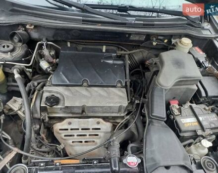 Серый Мицубиси Аутлендер, объемом двигателя 2.38 л и пробегом 143 тыс. км за 7300 $, фото 20 на Automoto.ua