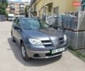 Серый Мицубиси Аутлендер, объемом двигателя 2 л и пробегом 235 тыс. км за 9000 $, фото 1 на Automoto.ua