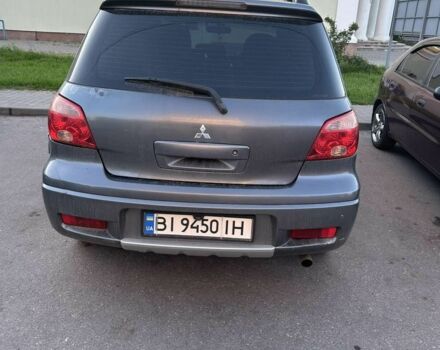 Серый Мицубиси Аутлендер, объемом двигателя 2 л и пробегом 218 тыс. км за 6100 $, фото 1 на Automoto.ua