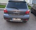Серый Мицубиси Аутлендер, объемом двигателя 2 л и пробегом 218 тыс. км за 6100 $, фото 1 на Automoto.ua