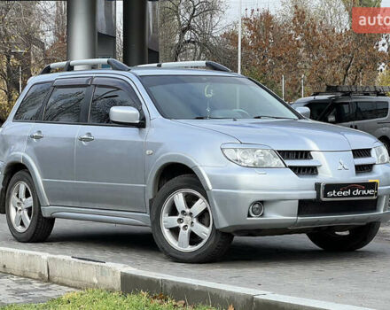 Серый Мицубиси Аутлендер, объемом двигателя 2.38 л и пробегом 197 тыс. км за 7699 $, фото 2 на Automoto.ua