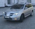 Серый Мицубиси Аутлендер, объемом двигателя 2.4 л и пробегом 191 тыс. км за 7000 $, фото 1 на Automoto.ua