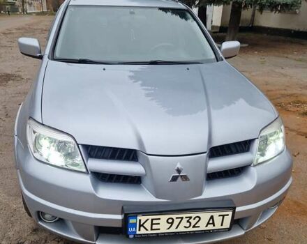 Серый Мицубиси Аутлендер, объемом двигателя 2.38 л и пробегом 113 тыс. км за 8900 $, фото 1 на Automoto.ua
