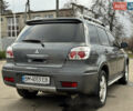 Серый Мицубиси Аутлендер, объемом двигателя 2.38 л и пробегом 254 тыс. км за 7300 $, фото 13 на Automoto.ua