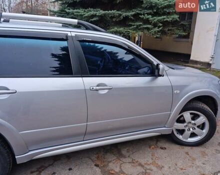 Серый Мицубиси Аутлендер, объемом двигателя 2.38 л и пробегом 113 тыс. км за 8900 $, фото 3 на Automoto.ua