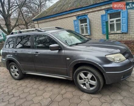 Серый Мицубиси Аутлендер, объемом двигателя 2.38 л и пробегом 143 тыс. км за 7300 $, фото 1 на Automoto.ua