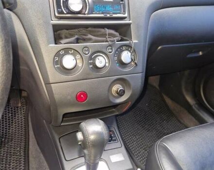 Серый Мицубиси Аутлендер, объемом двигателя 2.38 л и пробегом 113 тыс. км за 8900 $, фото 4 на Automoto.ua