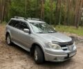Серый Мицубиси Аутлендер, объемом двигателя 2.4 л и пробегом 225 тыс. км за 6500 $, фото 1 на Automoto.ua