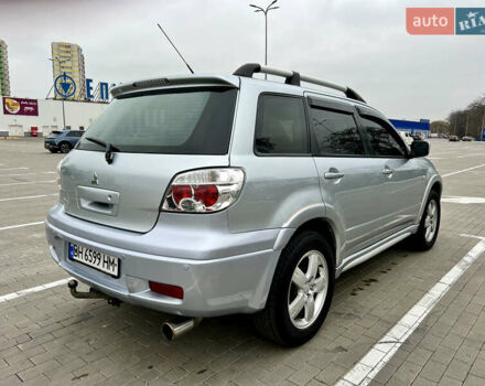 Серый Мицубиси Аутлендер, объемом двигателя 2 л и пробегом 209 тыс. км за 7200 $, фото 6 на Automoto.ua