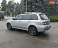 Сірий Міцубісі Аутлендер, об'ємом двигуна 2.38 л та пробігом 230 тис. км за 5700 $, фото 4 на Automoto.ua
