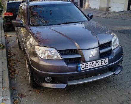 Серый Мицубиси Аутлендер, объемом двигателя 2 л и пробегом 176 тыс. км за 5400 $, фото 1 на Automoto.ua