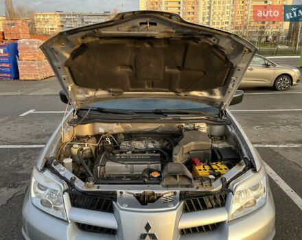 Серый Мицубиси Аутлендер, объемом двигателя 2 л и пробегом 138 тыс. км за 7000 $, фото 26 на Automoto.ua