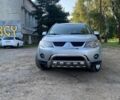 Сірий Міцубісі Аутлендер, об'ємом двигуна 2.4 л та пробігом 177 тис. км за 9500 $, фото 1 на Automoto.ua