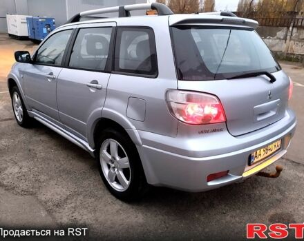 Серый Мицубиси Аутлендер, объемом двигателя 2 л и пробегом 198 тыс. км за 7700 $, фото 4 на Automoto.ua