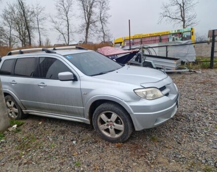 Серый Мицубиси Аутлендер, объемом двигателя 2.4 л и пробегом 350 тыс. км за 8000 $, фото 1 на Automoto.ua