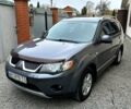 Серый Мицубиси Аутлендер, объемом двигателя 2.4 л и пробегом 153 тыс. км за 11500 $, фото 1 на Automoto.ua
