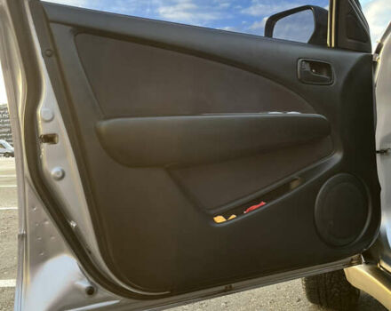 Серый Мицубиси Аутлендер, объемом двигателя 2 л и пробегом 138 тыс. км за 7000 $, фото 15 на Automoto.ua