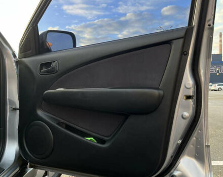 Серый Мицубиси Аутлендер, объемом двигателя 2 л и пробегом 138 тыс. км за 7000 $, фото 18 на Automoto.ua